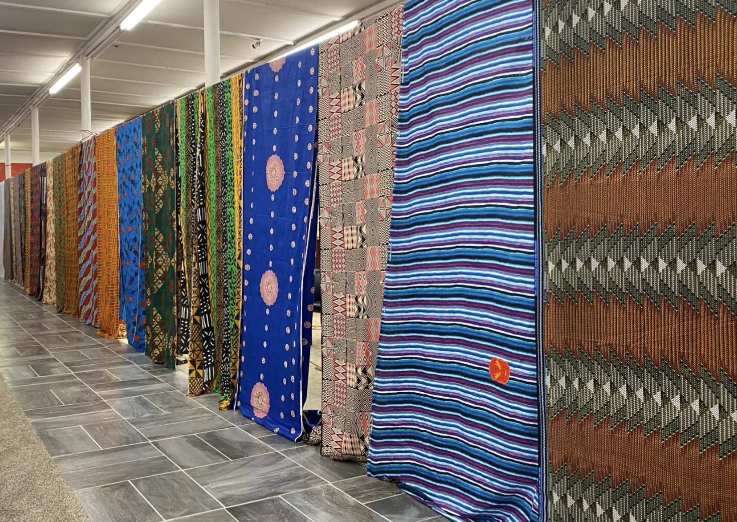 Woodlawn’s Nmosa Fabrics moves into new storefront nearby